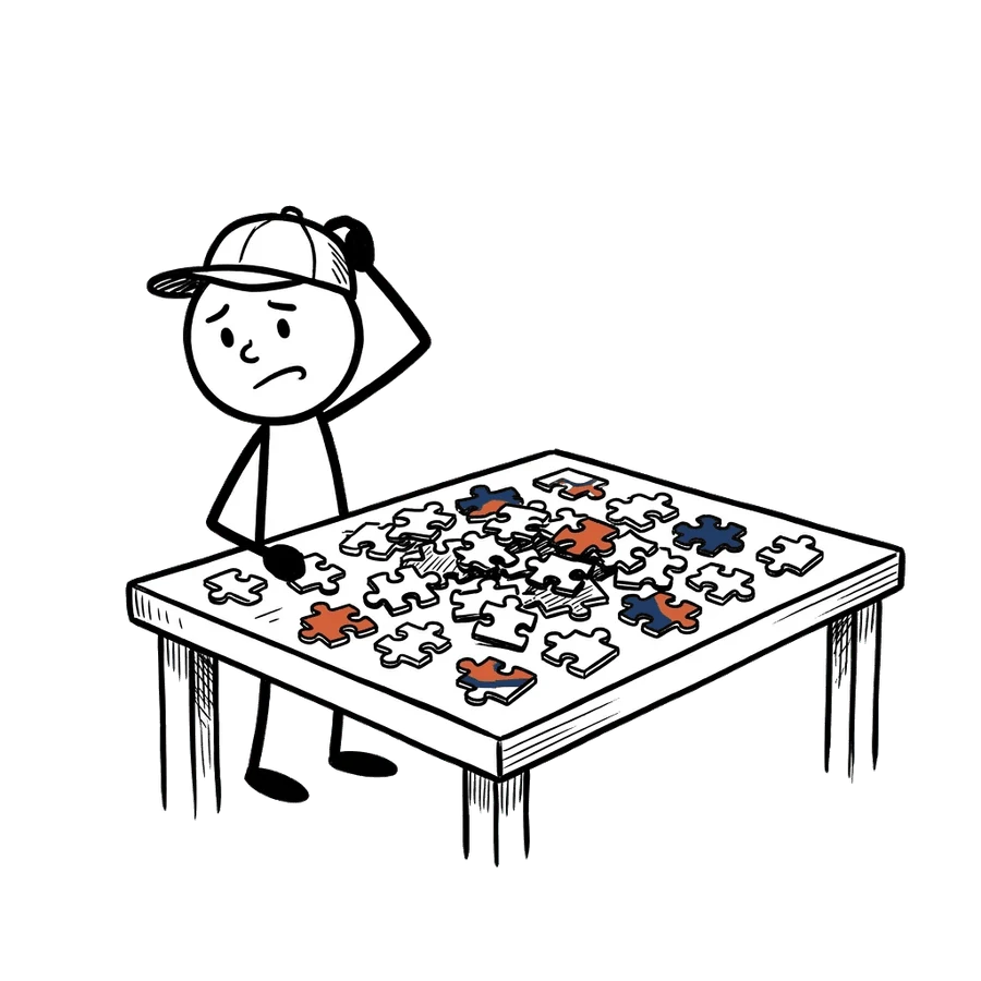 Stick figure scratching his head at a table of jigsaw pieces with no picture on the box.